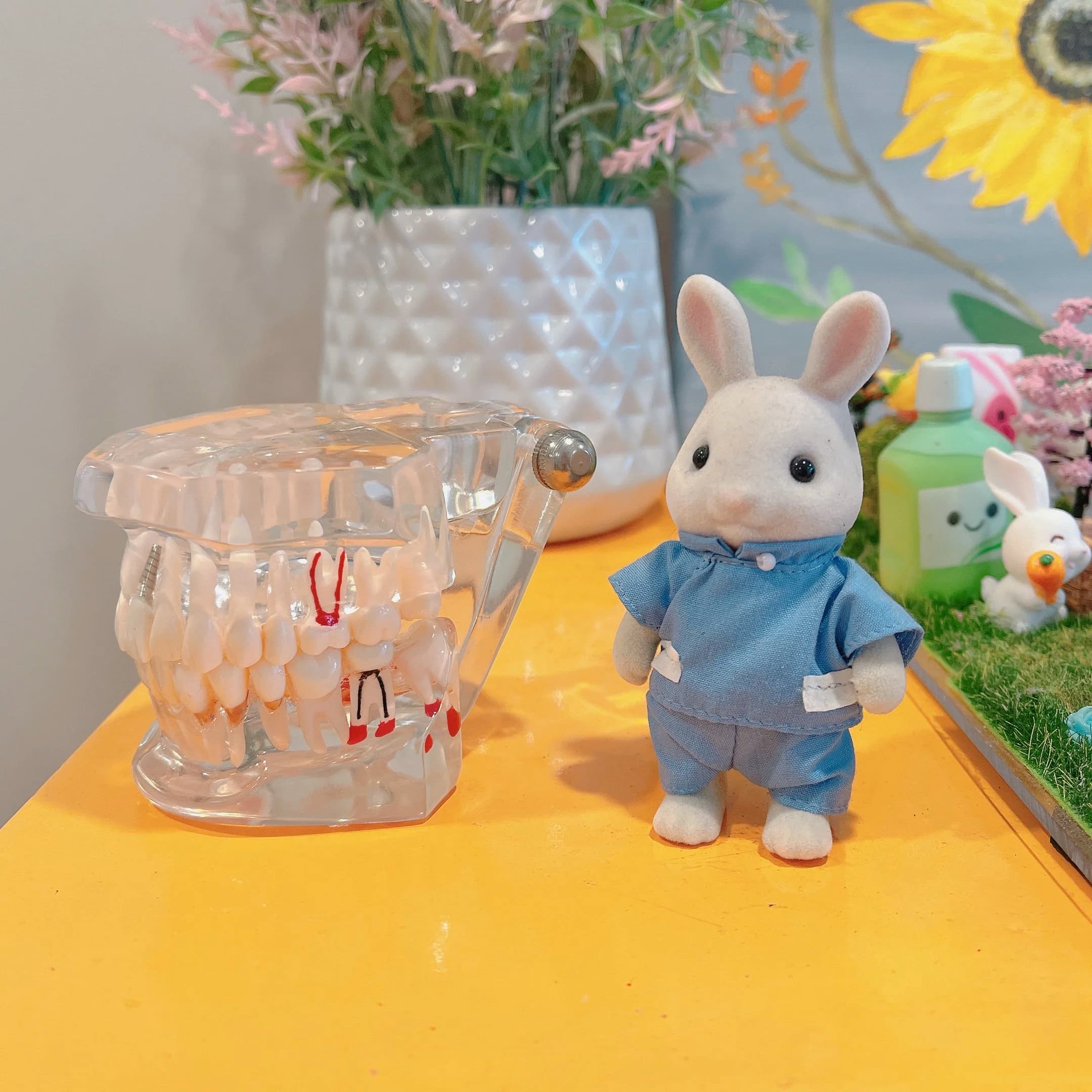 Child-friendly dental display with a tooth model and toy bunny to help make dental visits feel welcoming.