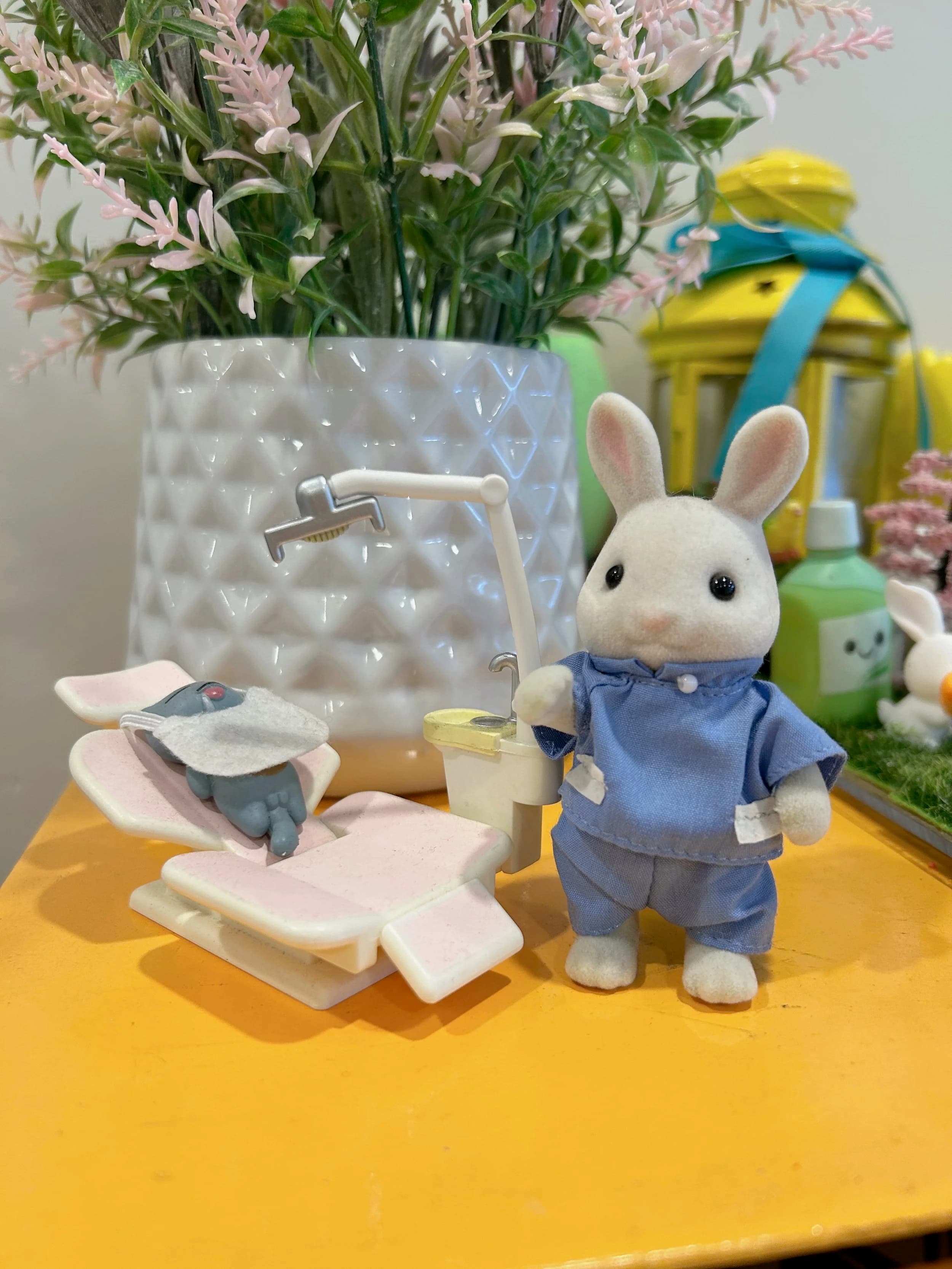 Playful dental office display with a toy bunny dentist and miniature dental chair to help children feel comfortable.